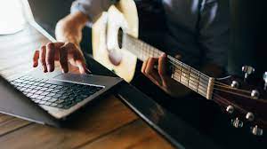 person having online guitar lessons in adelaide